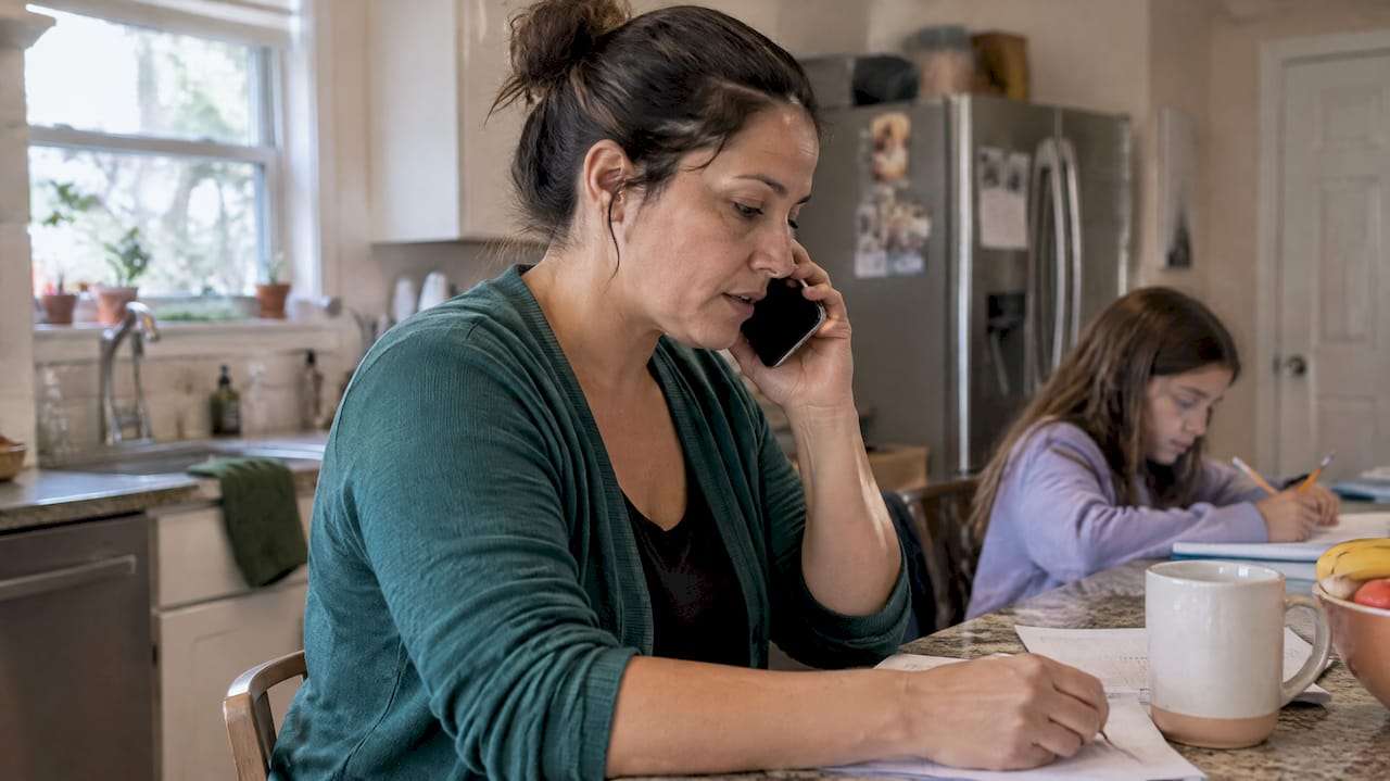 Parent verifying family mental health coverage by phone