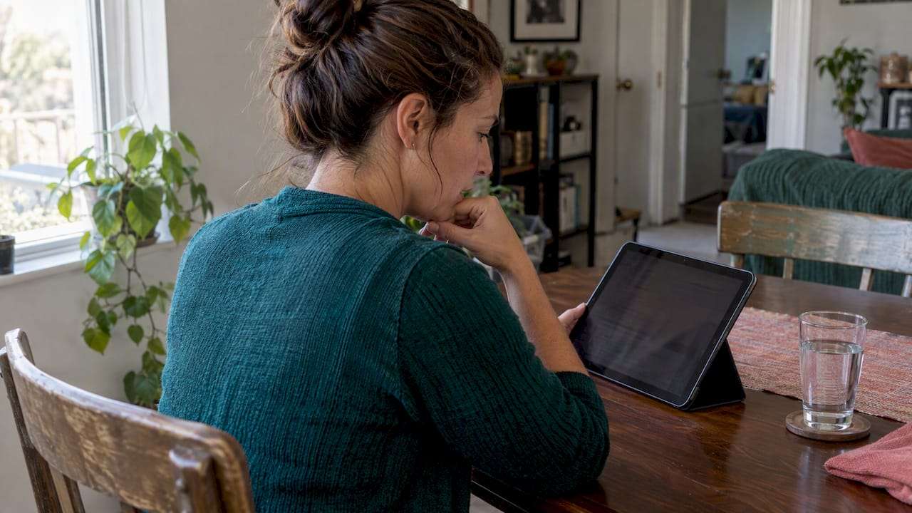Woman comparing Marketplace insurance premium estimates