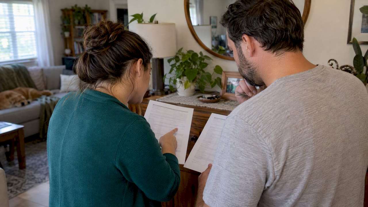 Couple comparing family health coverage options