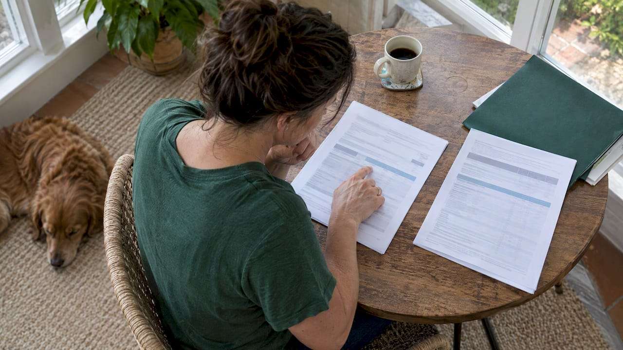 Parent reviewing family deductible plan documents