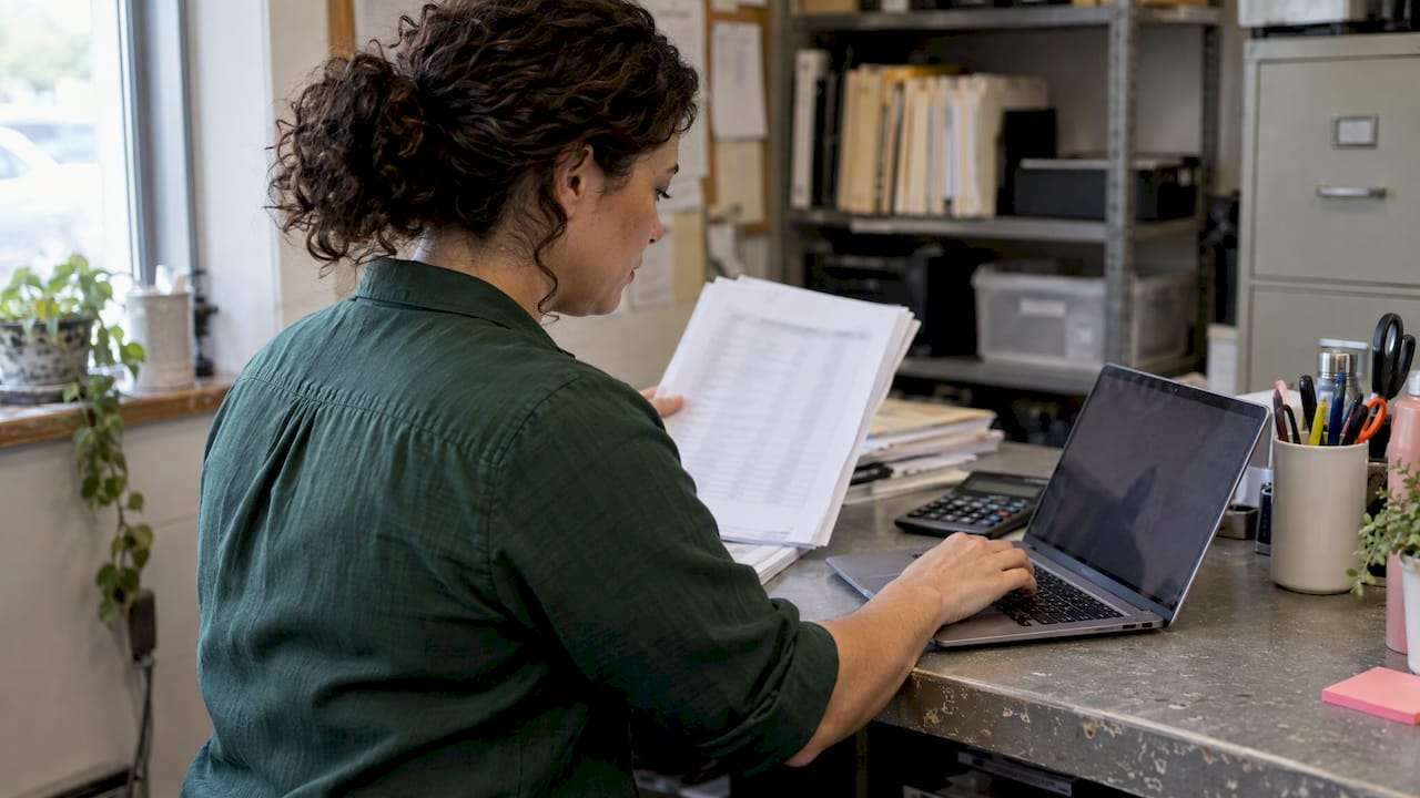 Small business owner checking employee count