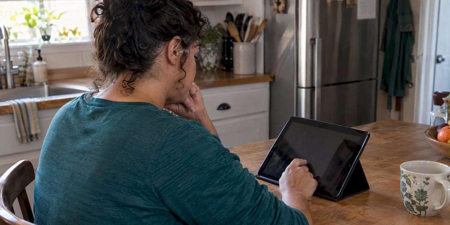 Woman reviewing a Marketplace application at home